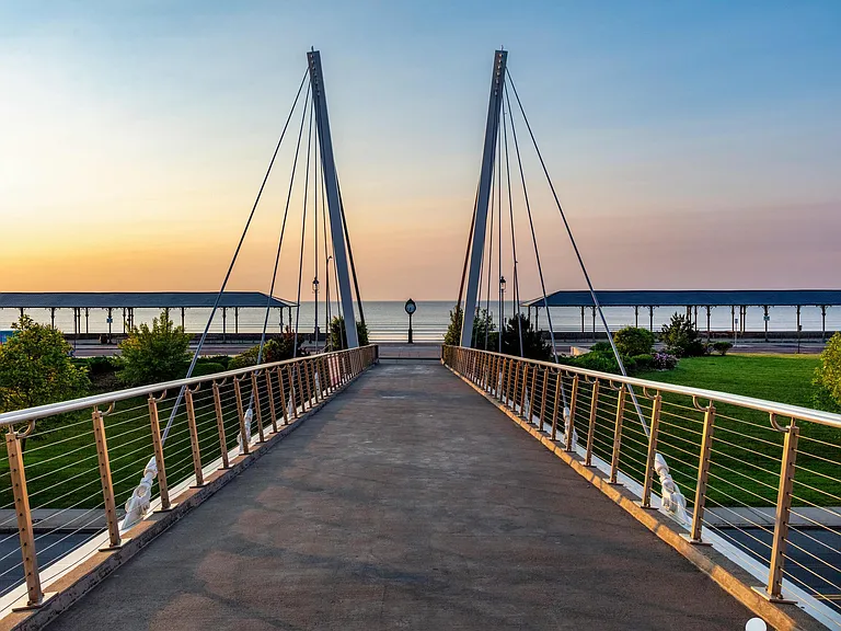 A stunning pedestrian bridge leads you straight to Revere Beach, where sunrise strolls and ocean views become part of your daily rhythm.