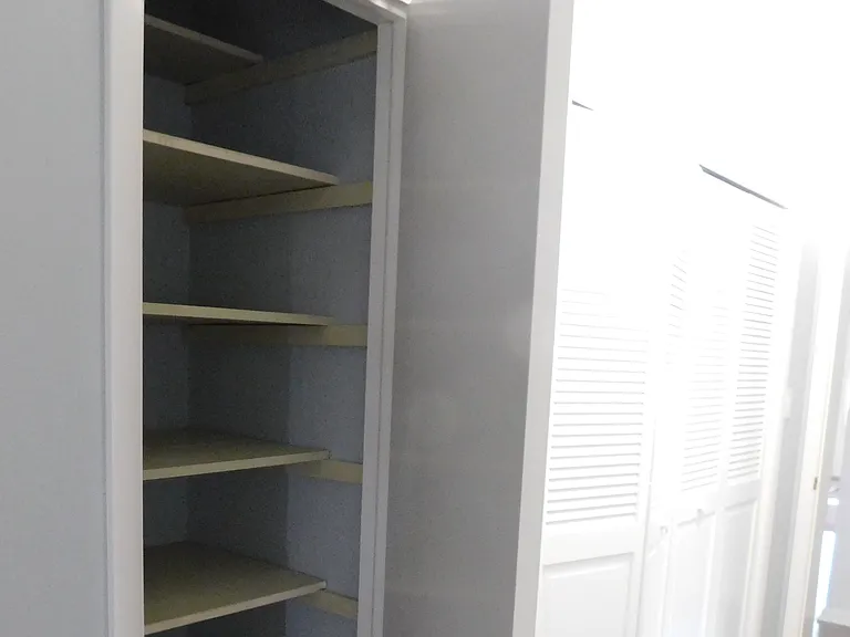 The first closet on the left of the hallway contains shelving perfect for linens. It's about 2.5' x 2.5'.