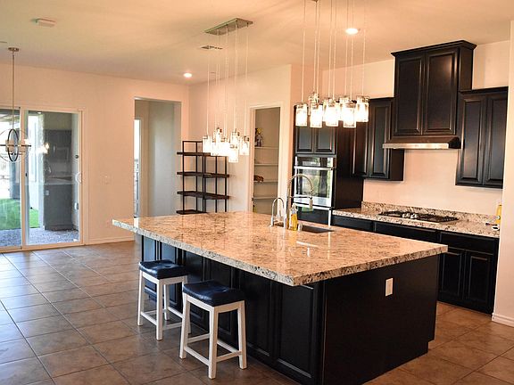 Kitchen with Stainless Steel Appliances, Large Kitchen Island, and Dual Ovens