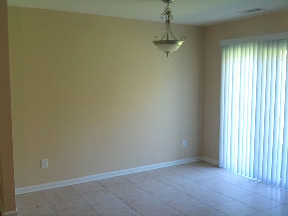 Ceramic tile floor in dining area.