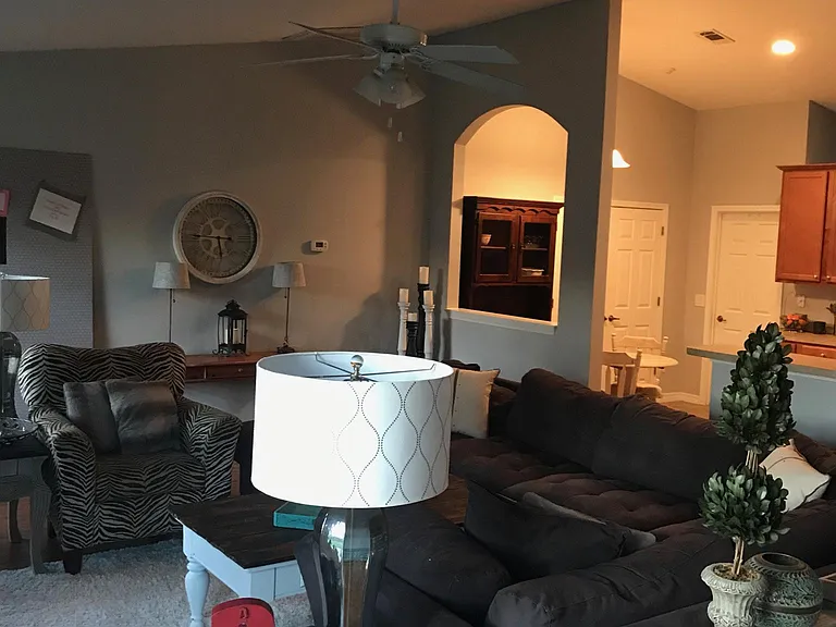 View across living. Kitchen, breakfast area and door to Lau
