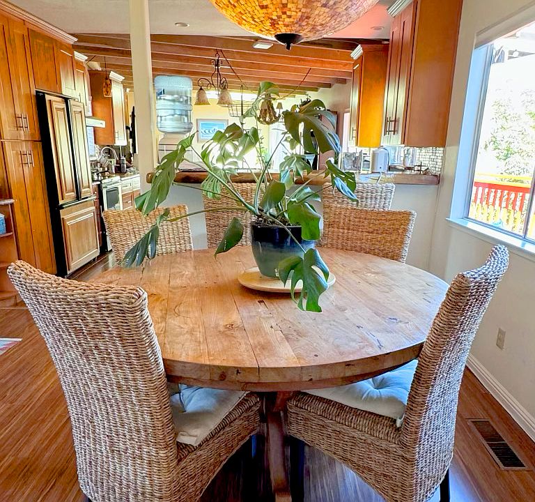 Dining room looking toward kitchen, stylish lighting