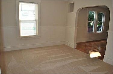 Brightly lit Living Room measures aprox 13x12.