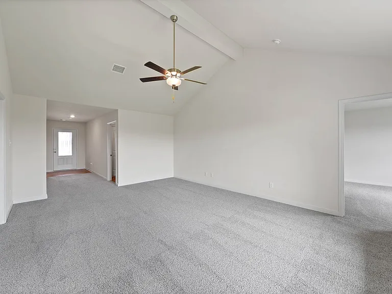 The spacious family room is perfect for family living and hosting.