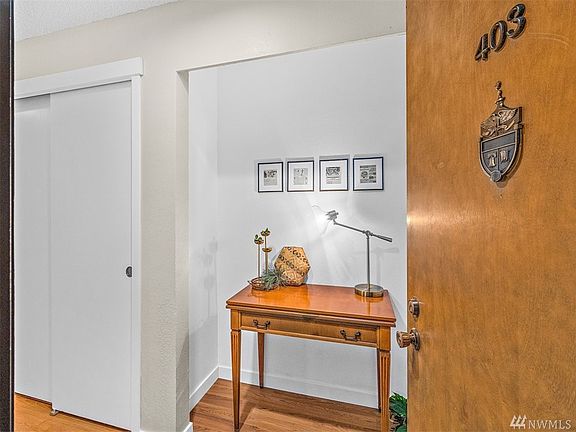 From the moment you enter this Top Floor Corner Unit #403, you'll notice the Pride of Ownership with Warm Wood Tones and Recent Updates throughout the Light Filled Unit with Panoramic Mountain, Sound and Territorial Views. 