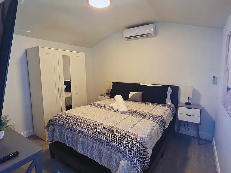 Cozy space featuring a TV, excellent natural lighting, a chair, and a side table