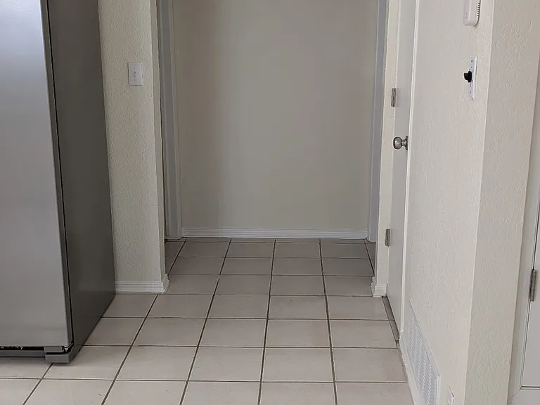Open doorway leading to 2nd and 3rd bedroom.