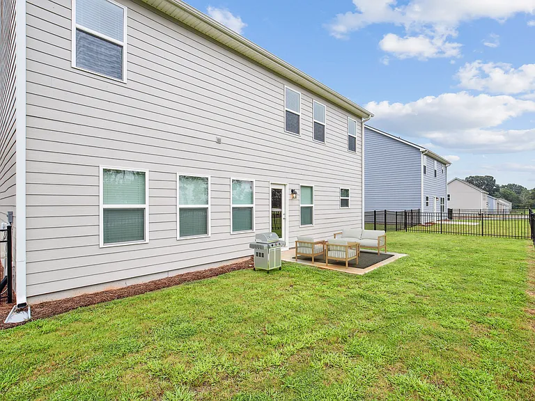 Back patio with fenced in yard.