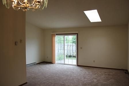 Living room from dining room area toward patio