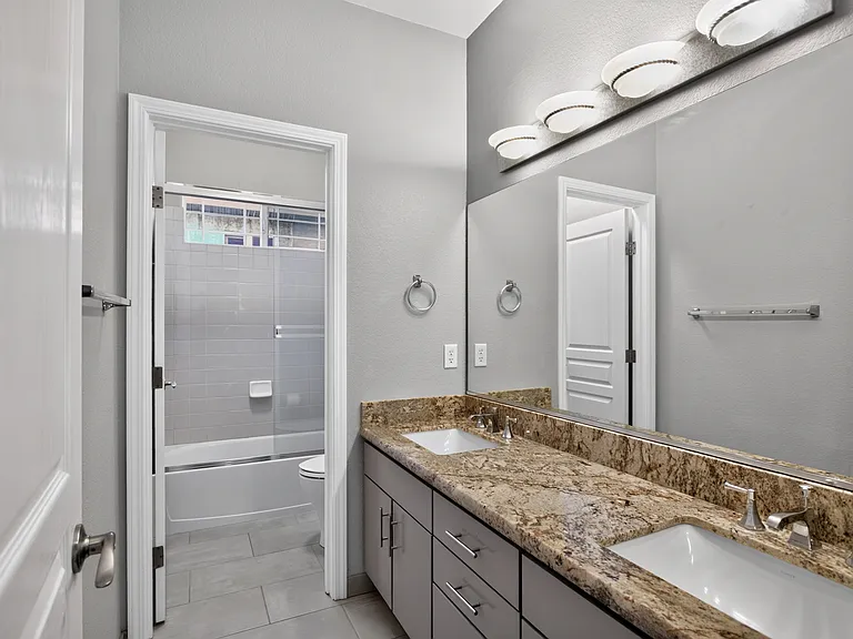 2nd Full bath located upstairs. Dual sinks in granite countertop. Tub/Shower in private alcove.