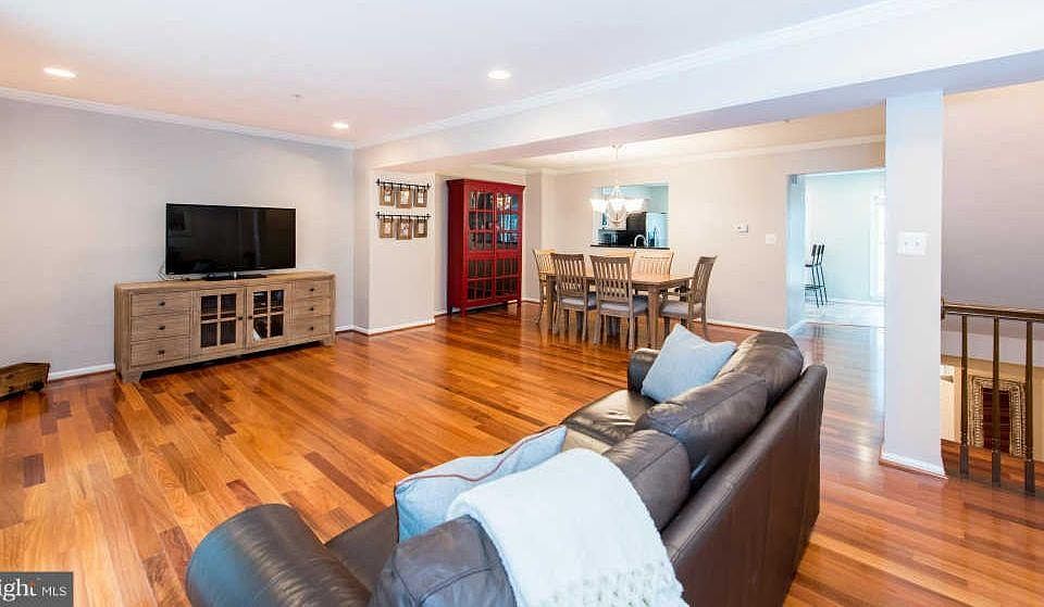 Open plan main level living room, dining area and kitchen