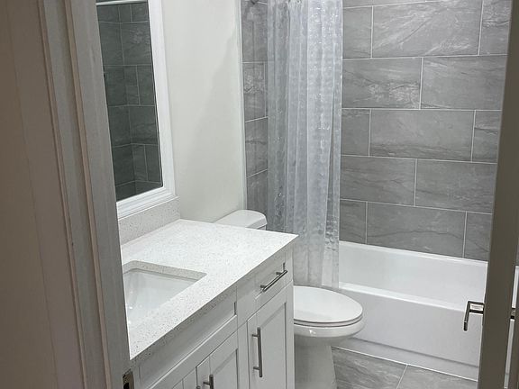 2nd Full Bathroom. Brand new Tile & Fixtures. Recessed Lighting.