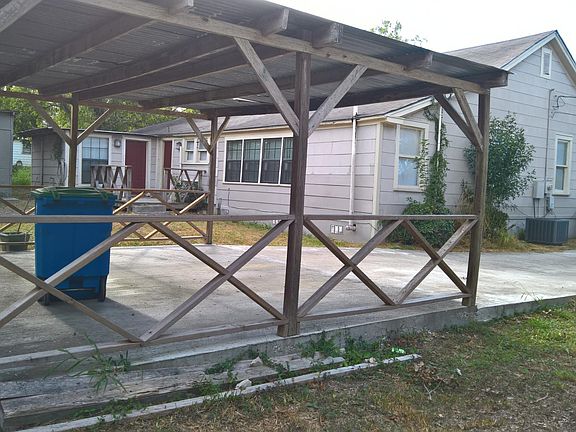 Long concrete drive, double car carport, storage shed and backyard.