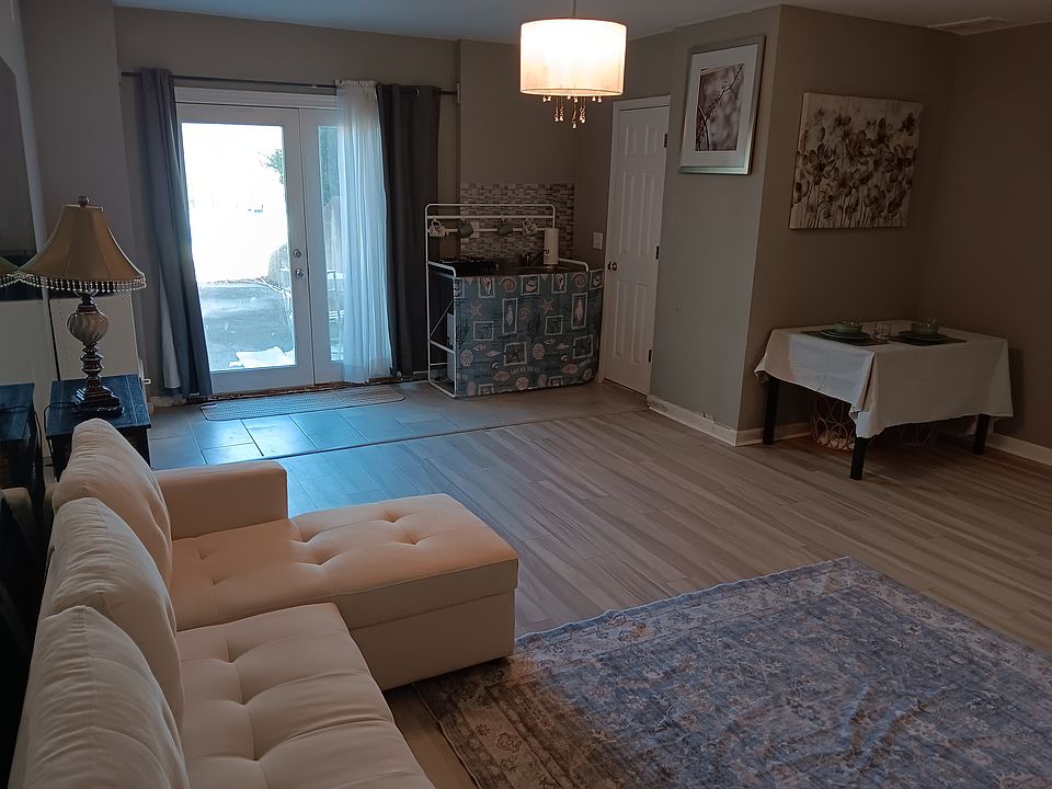 Light fixture has been replaced with a ceiling fan. Sofa converts to bed and has storage under the chaise.