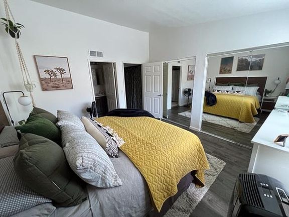 Master Bedroom with king bed.. private bath, mirrored closet doors