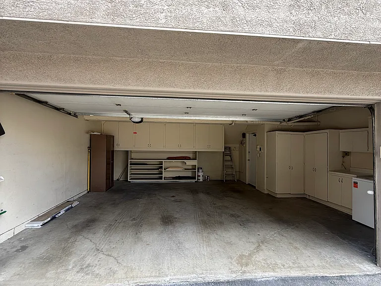 Two car spacious garage with ample storage