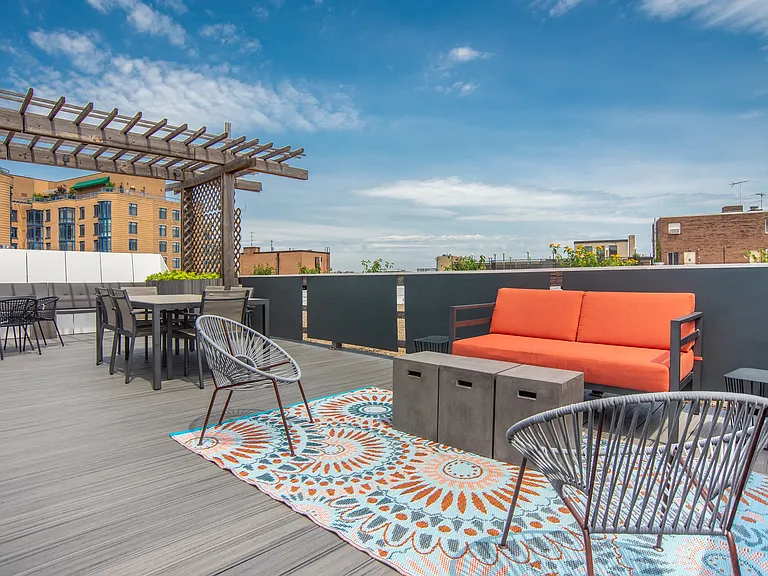 Rooftop Deck with Lounge Seating and Pergola Dining