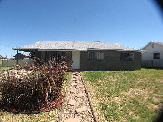 Block home with a carport