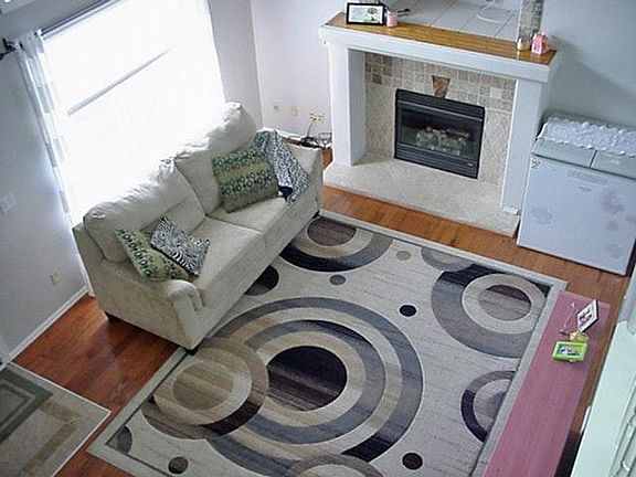 LIVING ROOM WITH GAS FIREPLACE AND HARDWOOD FLOOR