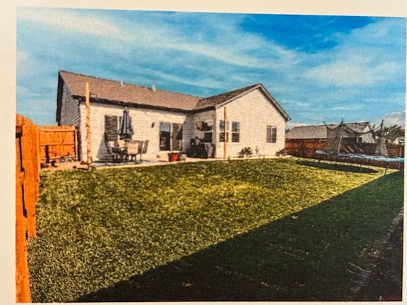 The private back yard is in the process of having trees planted, and has a sprinkler system.