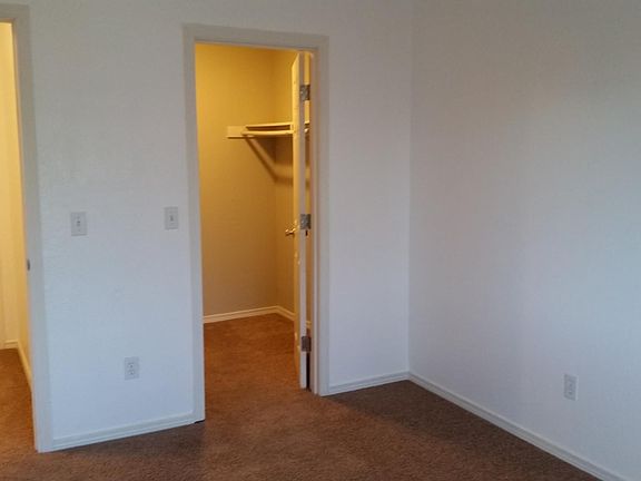 Master bedroom with large walk-in closet.