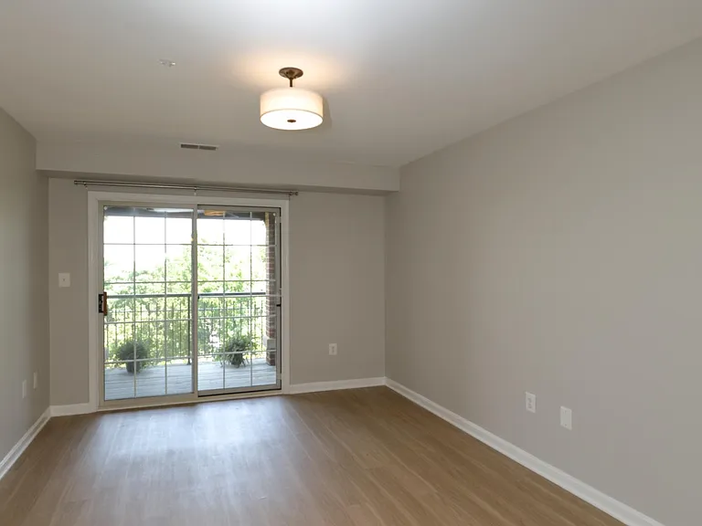 Master bedroom with view of balcony