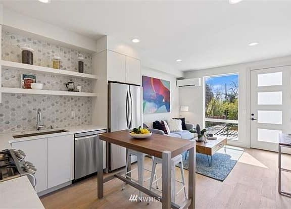 no island, its an open space. The picture has staged furniture