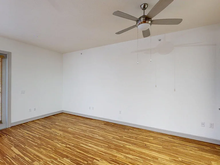 Apartment Living Room with Wood Style Flooring.