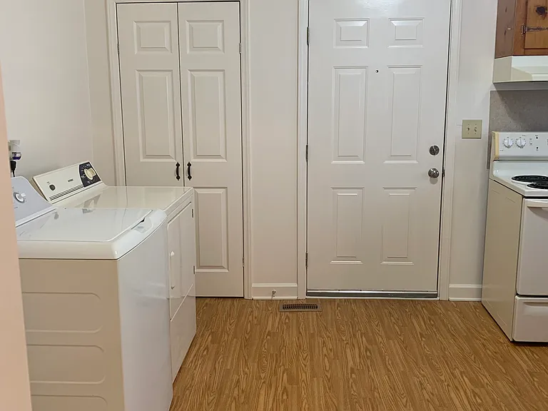 Kitchen view from bedroom doorway
Laundry, pantry doors & rear exterior door.