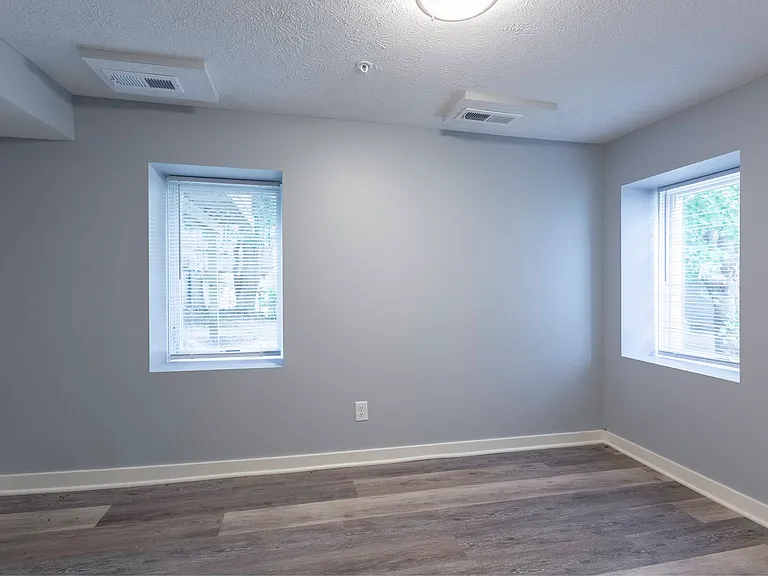 Two windows in a bedroom at Park Avenue Apartments.