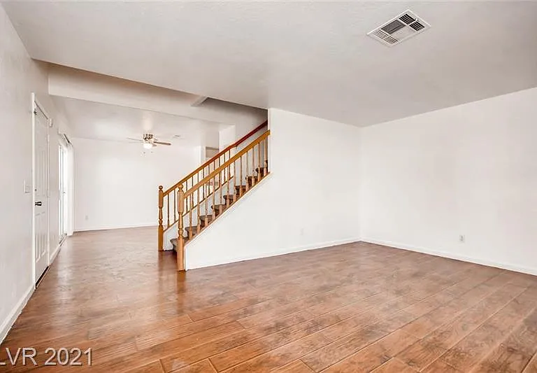 Living room, stair case and dining area