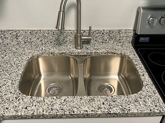 Granite Countertops with Stainless Sink and Appliances