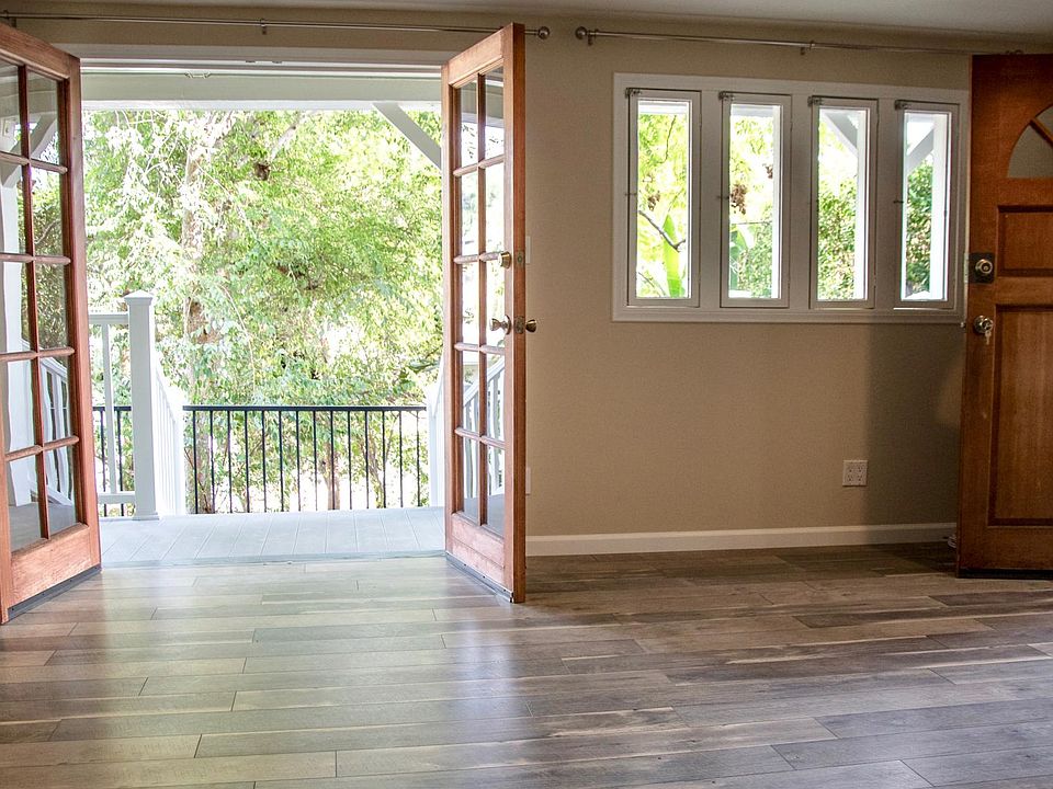 Main living room with gorgeous french doors and lots of sunlight