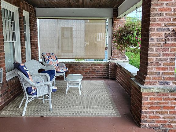 Large front porch with shade screen