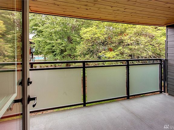 South facing balcony with views of pool and manicured grounds