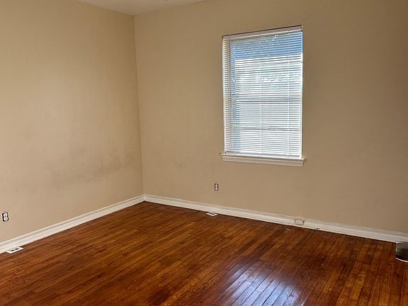 Living room looking into the dining area and kitchen