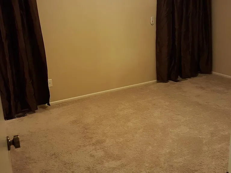 Large master bedroom with his and hers closets
