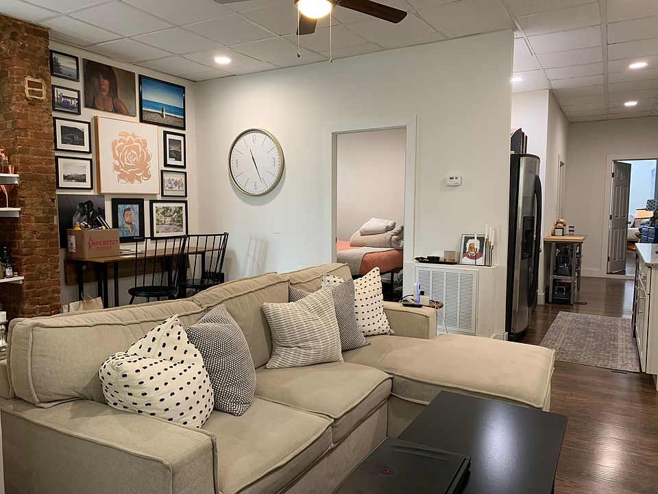 plenty of space for a WFH office station in the living room to the left and/ or right of decorative fi