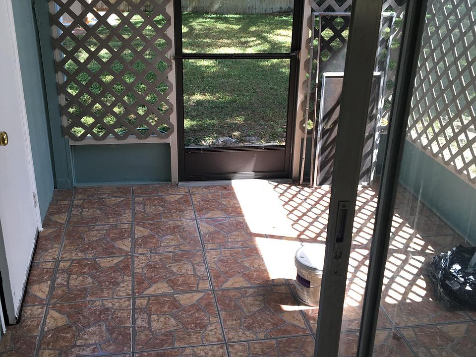 Screened in porch, with enclosed storage to the left inside includes washer/drier hookups.