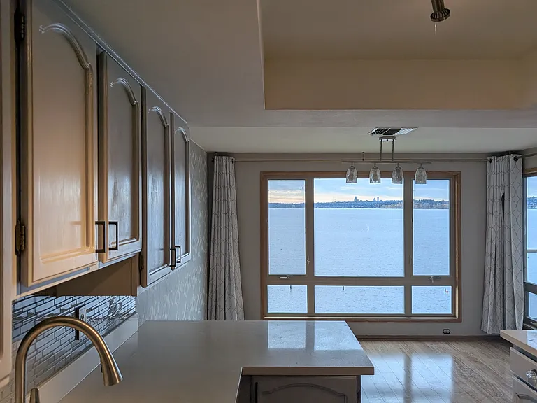 Kitchen has separate dining area with view.