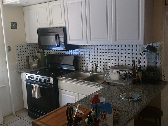 Tile back splash with microwave and stove