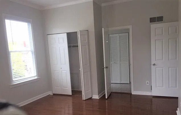 master bedroom closets and bathroom entrance