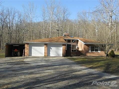 This wonderful ranch is set back deep from the road and surrounded by mature trees.