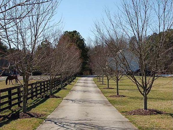 From the moment you drive down the tree-lined driveway...this is home!