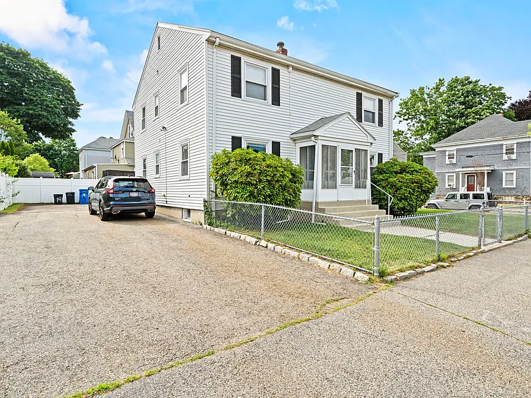 4 dedicated, non-shared off-street parking spots on the right side of the driveway.