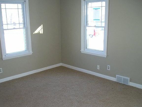 Bright & sunny living room with new carpet and paint