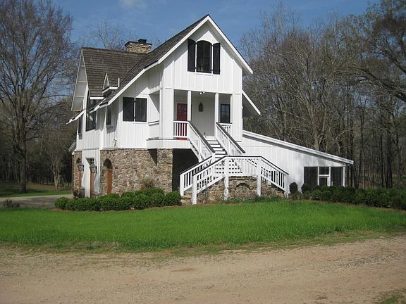 Main house, three levels; master bedroom and bath, 18' X 30' great room with fireplace, upper level sleeping loft, standing seam metal and cedar shake roof, Jeld Wen casement windows, ground floor efficiency apartment and garage.