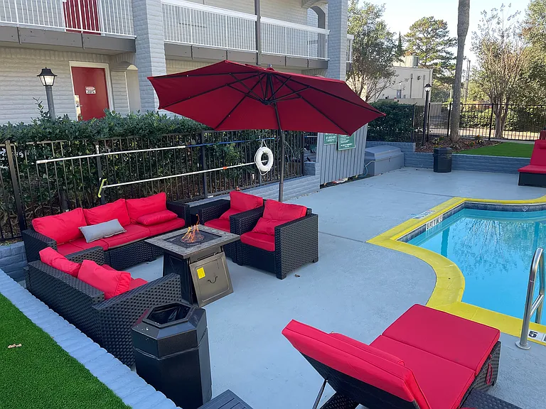 Relax in style at this chic outdoor lounge by the pool.