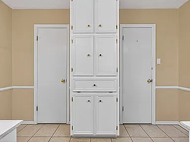 primary bathroom storage with access to closet and water closet