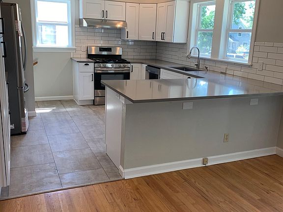 Bright, remodeled kitchen with quartz countertops